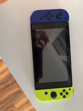 Nintendo Switch Handheld Console with Blue and Neon Yellow no cracks in screen )
